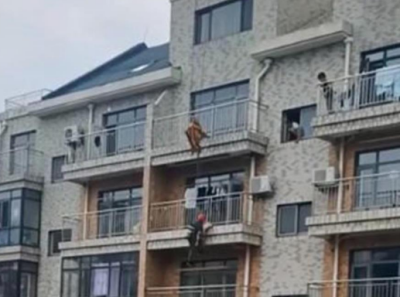 女童身体悬空头部卡在6楼护栏上 工人开塔吊施救